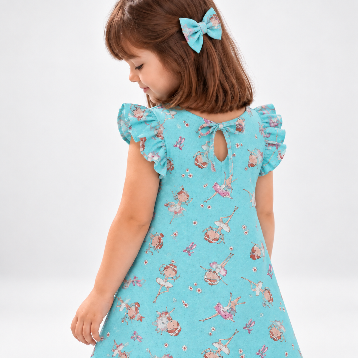 Girl in Ballet dress holding matching Alice doll, with Petit Case